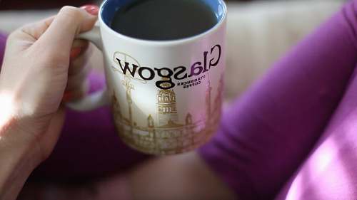coffee cup person holding ceramic mug with coffee inside glasgow